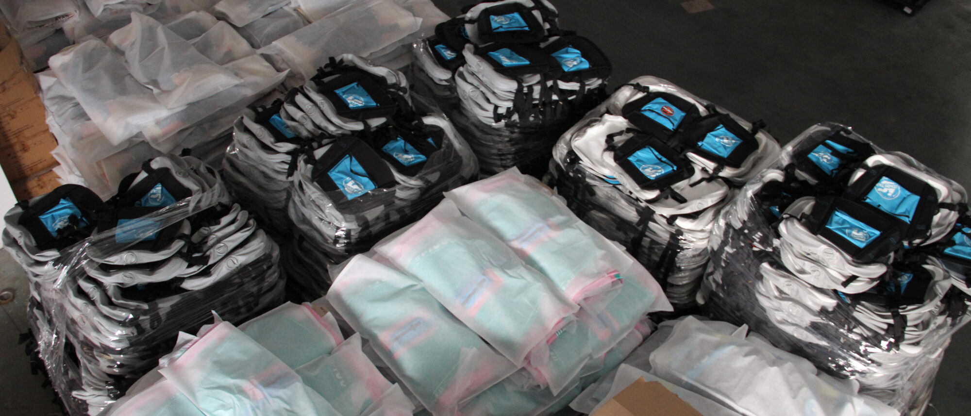 Wrapped finished boards and packed accessory cartons ready for despatch.